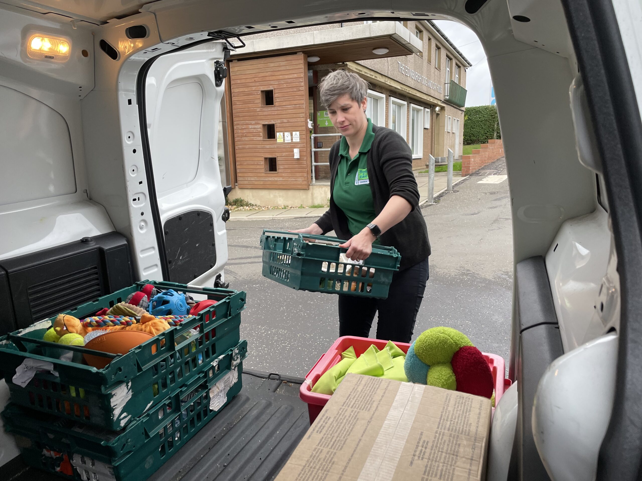 Woman loading dog food at food bank