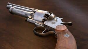 Magic Media game art production, a highly detailed 3D-rendered revolver with a wooden grip and aged metal, showcasing intricate design in game asset creation.